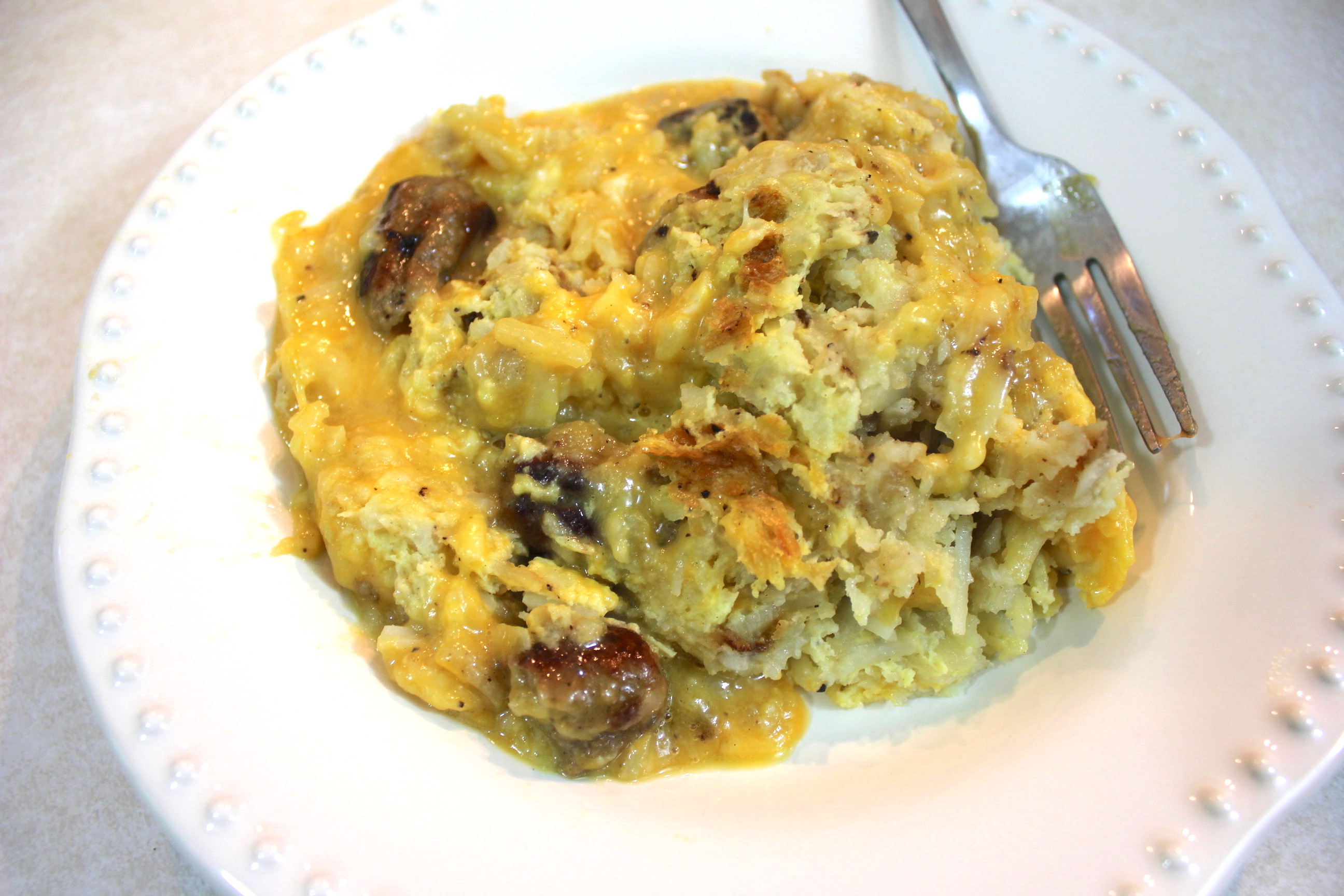 Breakfast casserole with hash browns, eggs and sausage